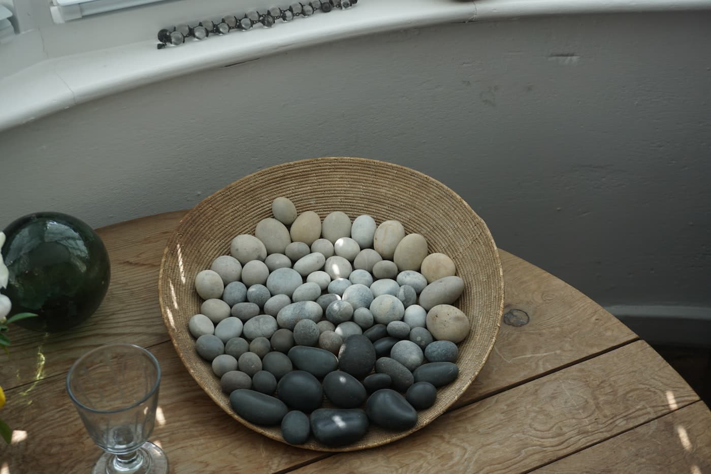 River stones on warm wood